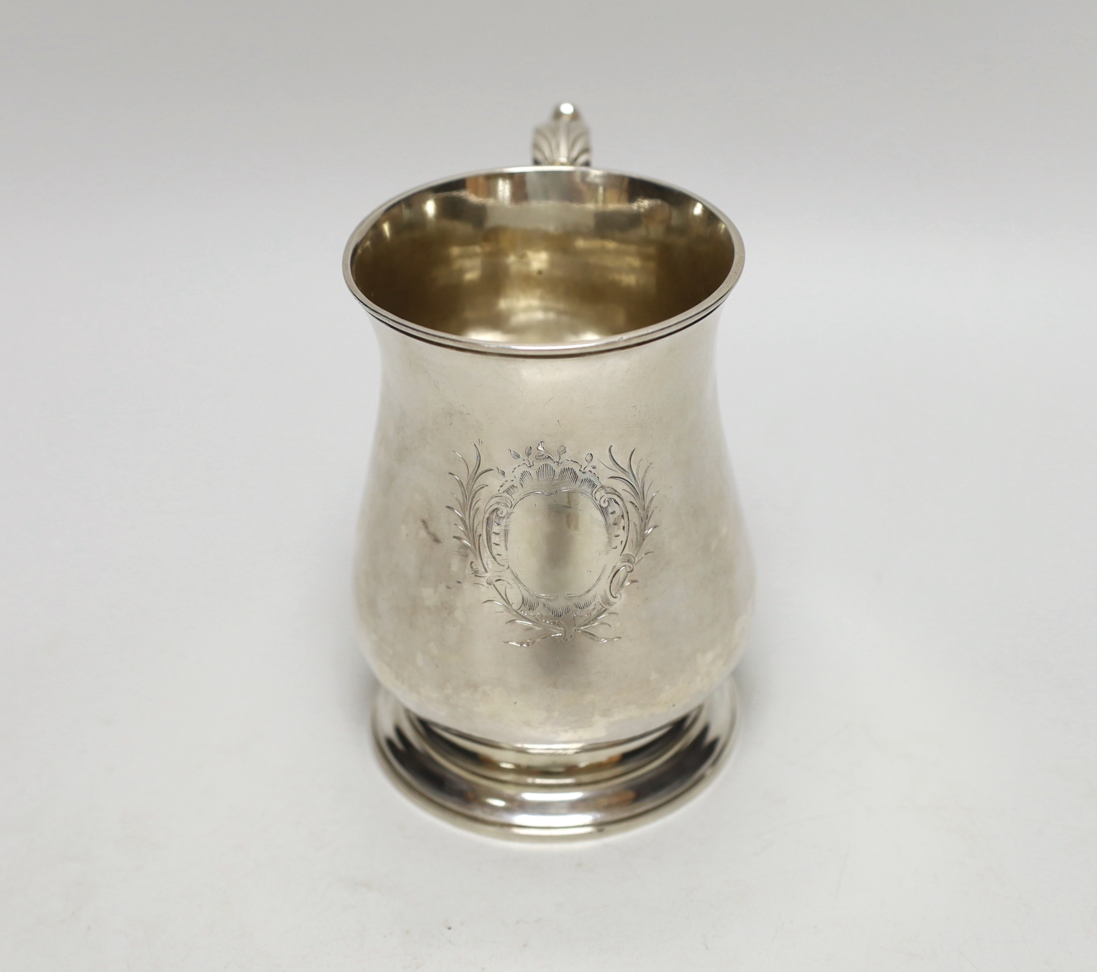 A George II silver baluster mug, with acanthus scroll handle, maker William Tuite, London 1767, 386 grams